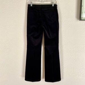 Black velvet corduroy flared leg stretch pants.